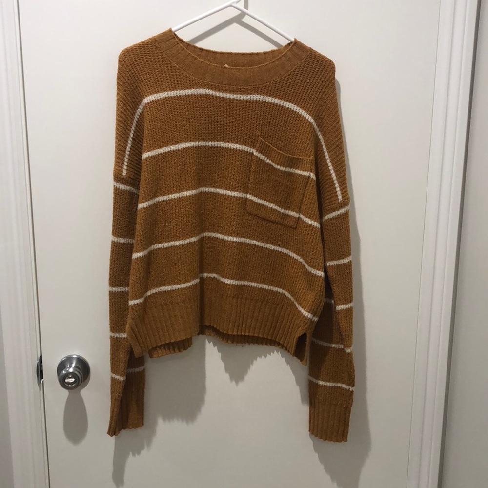 Mustard and white striped sweater.